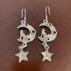 Howling wolves on crescent moon silver dangle earrings.